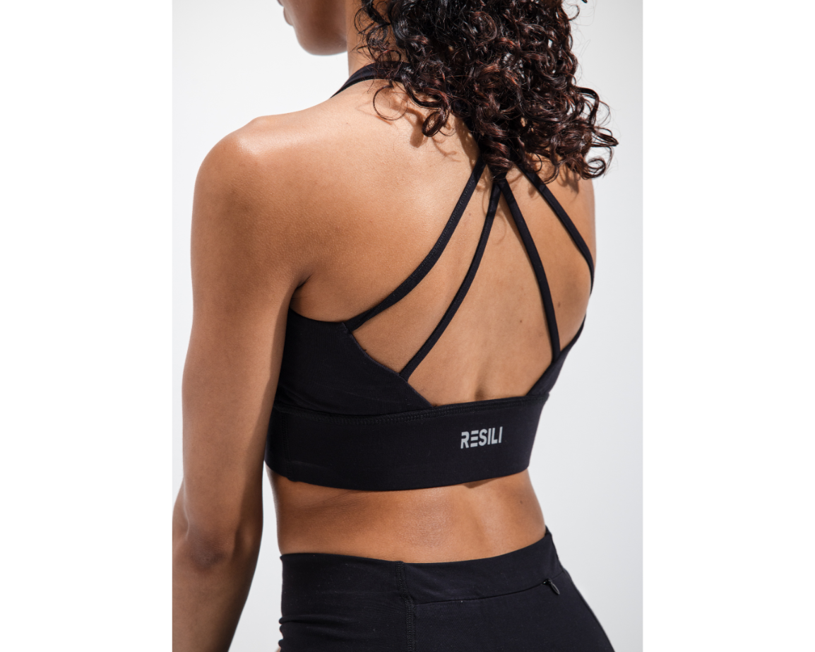 Black sports bra with 'RESILI' branding on a white background