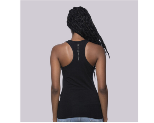 Person wearing a black tank top with text on the back against a light gray background