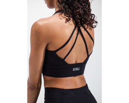 Black sports bra with 'RESILI' branding on a white background